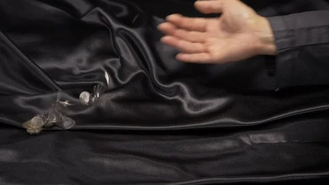 Side view- a lady counting loose change. 4k Stock Footage 96009538