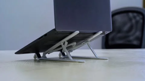 Side View of Laptop on Dual Adjustable Stands in Office Setup Stock Footage 312222875