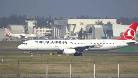 Side view of a large passenger airplane taxiing on the taxiway Stock Footage 237183417