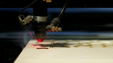 Side view laser cutting machine at work on wood Stock Footage 76393677