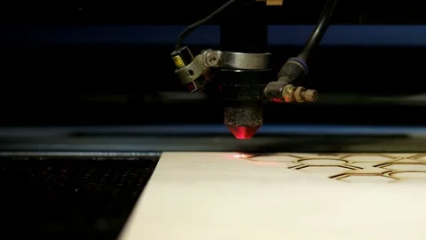 Side view laser cutting on wood Stock Footage 76393444