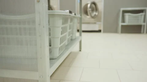 Side View Laundry Basket On Shelf In Blurred Laundry Room Stock Footage 318838502