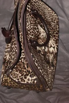 Side View of Leopard Print Duffel Bag with Shoulder Strap Stock Photos