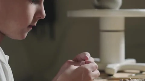 Side view of little boy plays with clay in pottery class Stock Footage 143618559