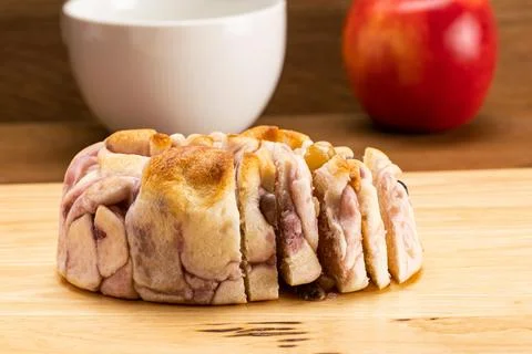 Side view a loaf of slice Purple Sweet Potato Bread with mixed bean on wooden Foto stock