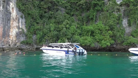 Side view from long tail boat,speed boat waiting for tourist swimming. Stock Footage 82301509