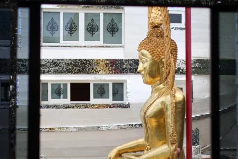 Side view Looking through the window of Golden Buddha at Wat phuttha prommayan Stock Photos