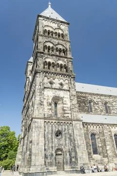 Side view of Lund Cathedral under clear blue sky in Sweden Stock Photos
