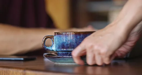 Side view of male hands typing on personal computer in coffee shop Stock Footage 163931792