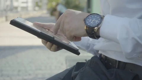 Side view of male hands working on white tablet Stock Footage 97922612