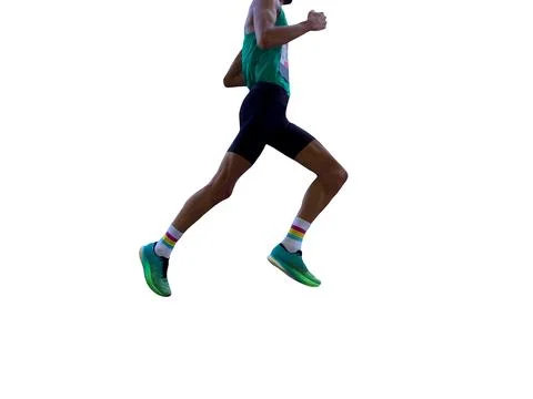 Side view male runner running marathon, figure in shadows Stock Photos