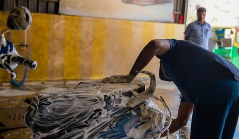 Side view of an male worker working in a warehouse Stock Photos