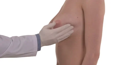 Side view of a mammologist doctor is checking woman breast. Isolated, white back Stock Footage 145769550