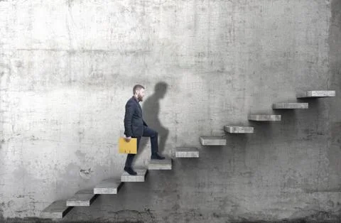 Side view of a man climbing up the steps in a blank concrete wall. 3d render Stock Photos