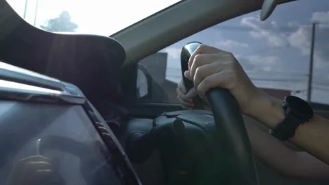 Side view of Man driving a car. detail on hands holding steering wheel. Stock-Footage 336267417