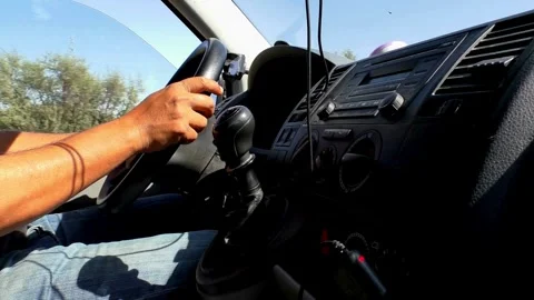 Side view of Man driving a car. detail on hands holding steering wheel. Stock-Footage 336267820