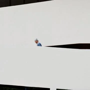 Side view of man going up stairs Stock Photos