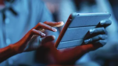 Side view man home using tablet Stock Photos