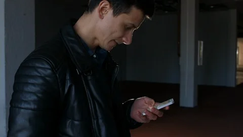 Side-View a Man Looking on Mobile HD Stock-Footage 92936843