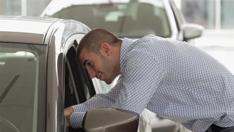 Side view of man looks into the interior Stock-Footage 252682157
