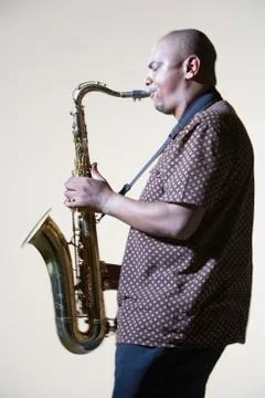 Side View Of Man Playing Saxophone Stock Photos