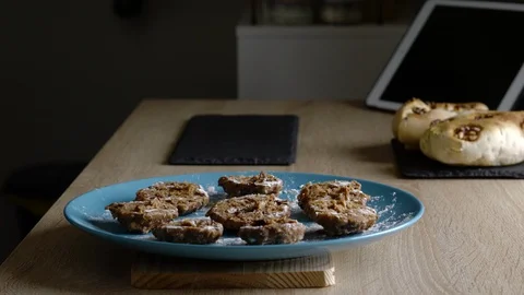 Side view of a man preparing oatmeal, banana and chocolate cookies Stock Footage 128828685