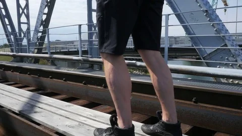 Side view of man running on the bridge Video stock 84004619