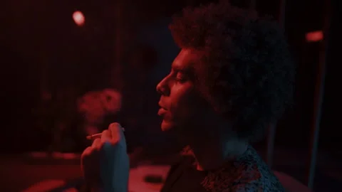 Side view of a Man smoking a cigarette Video stock 258344582