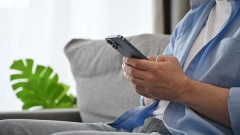 Side view on man typing on his smartphone. Mobile testing,online services Stock Footage 267484829