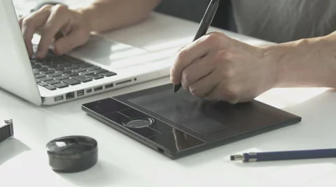 Side view man using his pen tablet Stock Footage 64776660