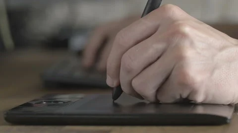 Side view man using his pen tablet Stock Footage 64905703