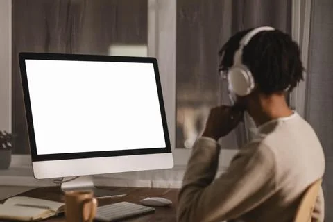 Side view man using modern computer headphones Beautiful photo 写真素材