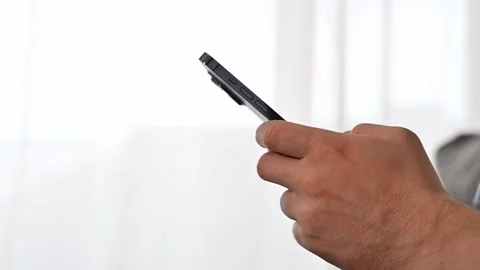 Side view on man using smartphone. Mobile games,testing concepts Stock Footage 253052915