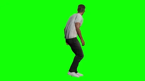 Side view of man walking with casual catwalk motion on green screen Stock Footage 328638810