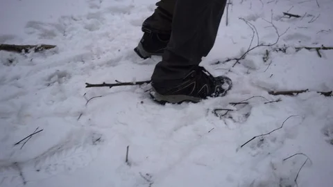 Side view of man walking in fresh snow ,forest, fitness, 4k, UHD Video stock 86607848