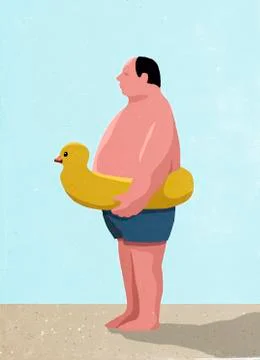 Side view of man wearing inflatable rubber duck ring at beach Ilustración de archivo