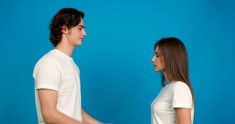 Side view of man with weding ring proposing to surprised girlfriend, kissing and Stock Footage 124536338