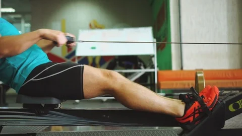 Side view of man which using rowing machine in gym. Stock Footage 111894991