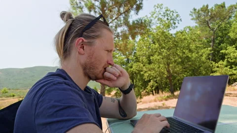 Side View of Man Working on Laptop at Table Video stock 344809357