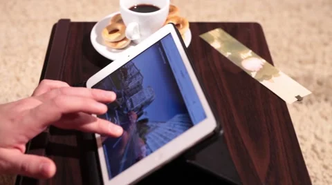 A side view of man working with tablet - panning shot Stock Footage 58395481
