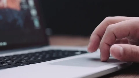 Side view man's hand work on laptop touchpad. Stock Footage 70940718