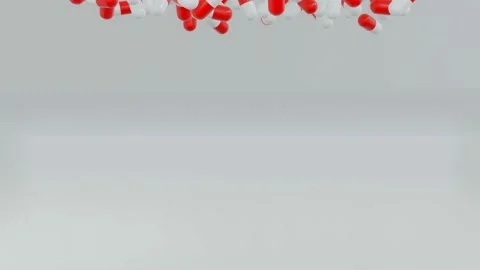 Side view of many capsule pills drop from the top in dif Stock Footage 133714089