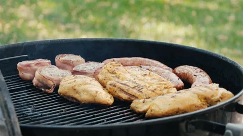 Side view of Meat cooking on bbq Stock Footage 280436363