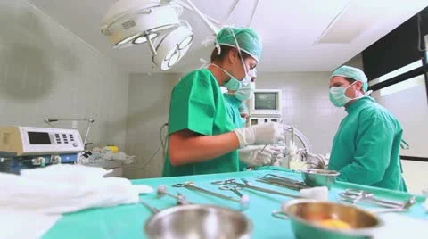 Side view of a medical team operating | Stock Video | Pond5