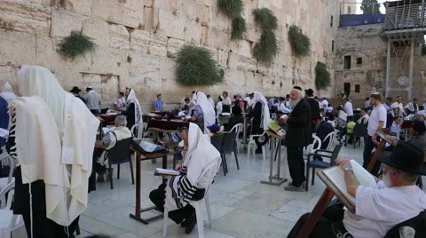 Side View of Men at Pray and Study at Western Wall in 4k Stock Footage 52935435