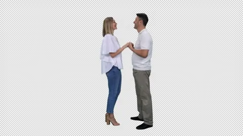 Side view of middle aged couple talking while standing, alpha channel in Video stock 304809436