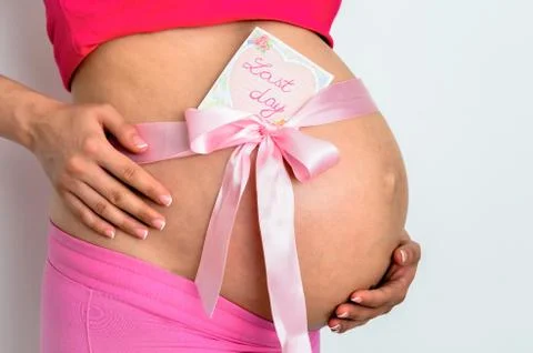 Side view  midsection of caucasian white pregnant young women  with  a  last Stock Photos