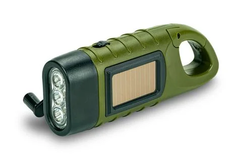 Side view of mini solar cranking LED flashlight. Stock Photos
