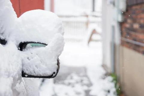 Side view mirror covered in snow Stock Photos