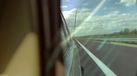 Side-view mirror in a vintage car. Driving along the expressway. Stock Footage 68028085
